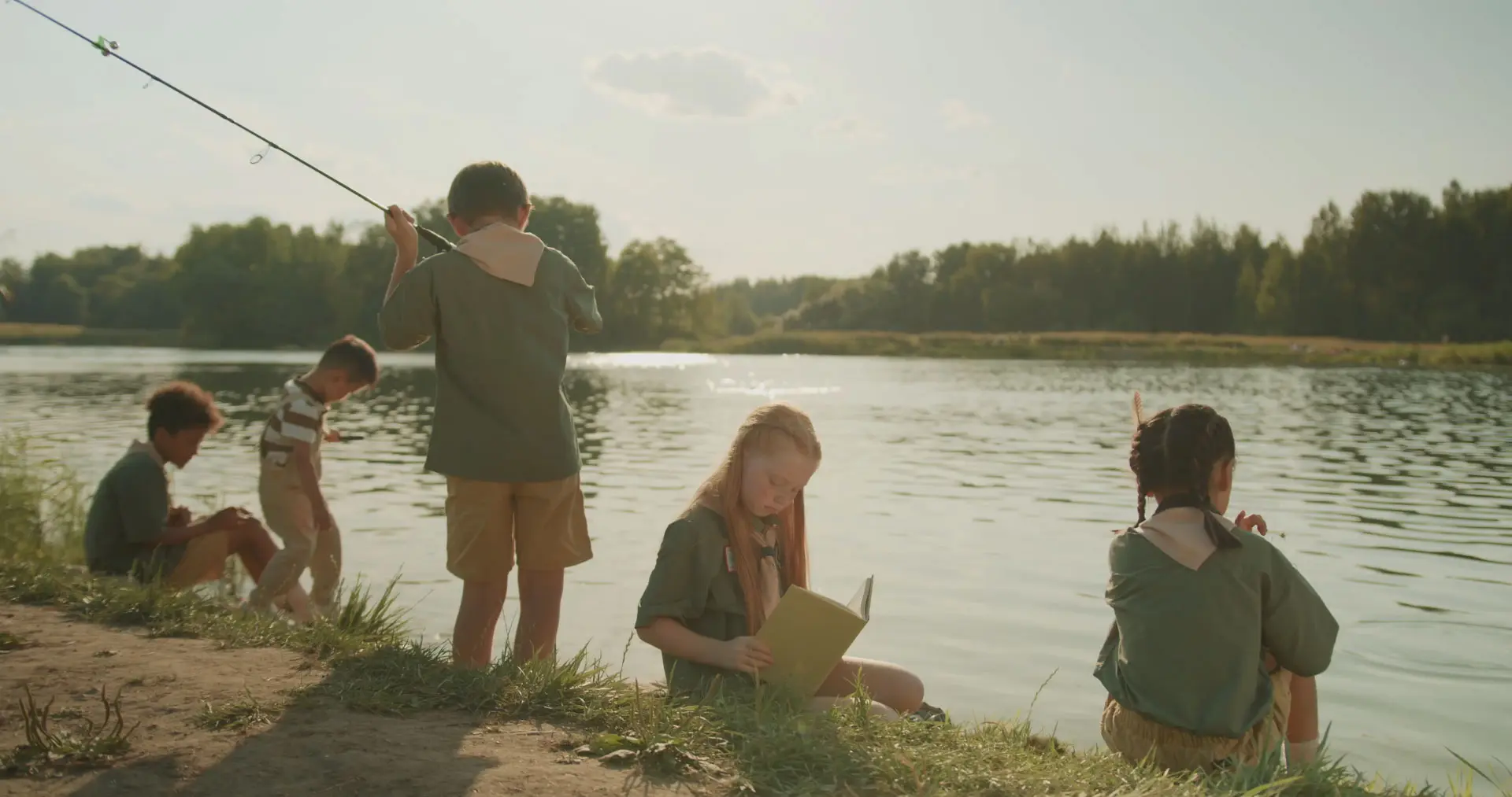 Camping kids by a lake